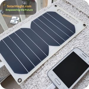 An image that shows a phone being charged with a small solar panel